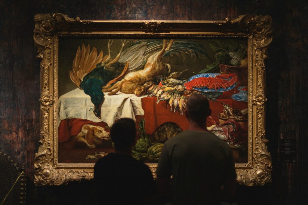 professional appraiser inspecting artwork to document collectible value for insurance