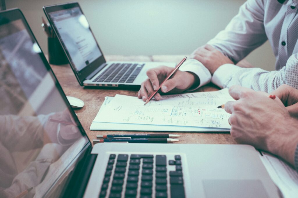 Business professionals reviewing financial loss documentation for a business interruption insurance claim