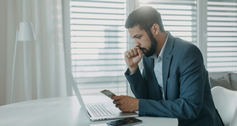 policyholder reviewing denied home insurance claim with concern