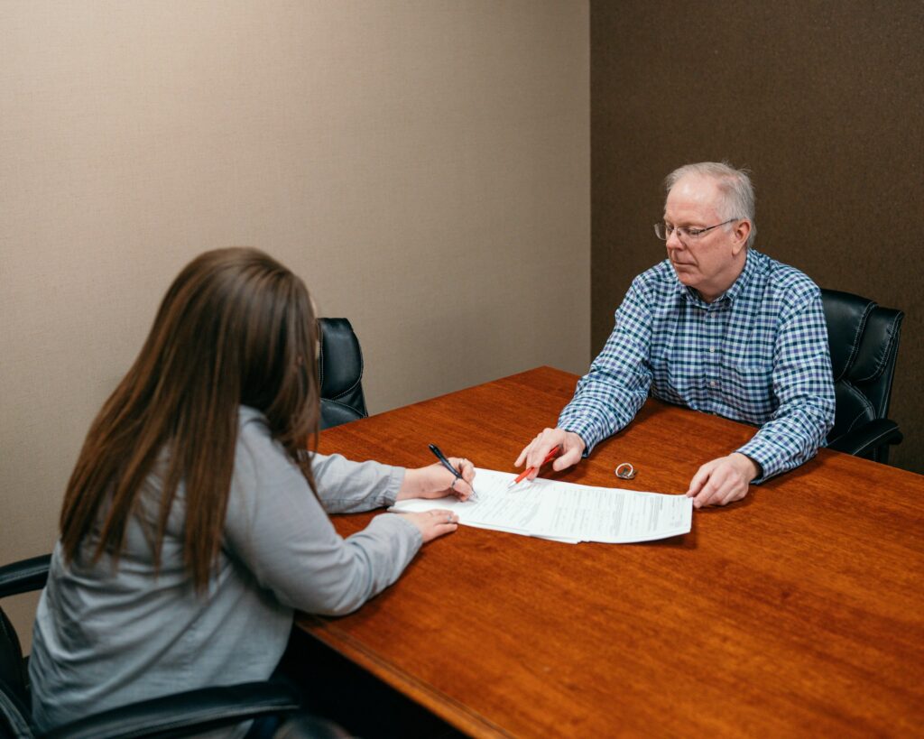 professional public adjuster consulting with policyholder about denied claim appeal