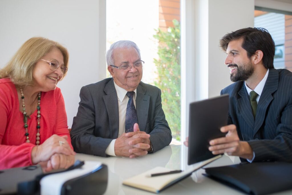 Public adjuster consulting with high-net-worth homeowners about luxury property insurance claims