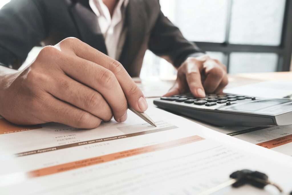 Forensic accountant analyzing financial records for insurance claim settlement