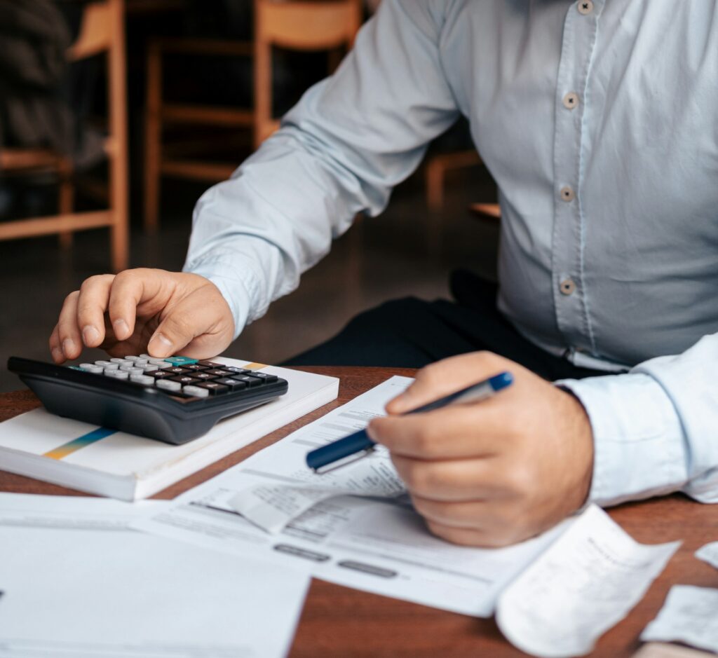 Business owner analyzing rising commercial insurance premiums due to climate risks
