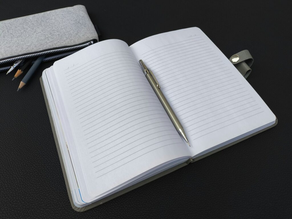 Insurance claim diary notebook with dates and notes