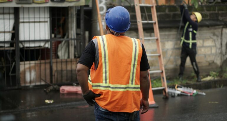 Public adjuster assessing storm damage on a commercial property after a disaster