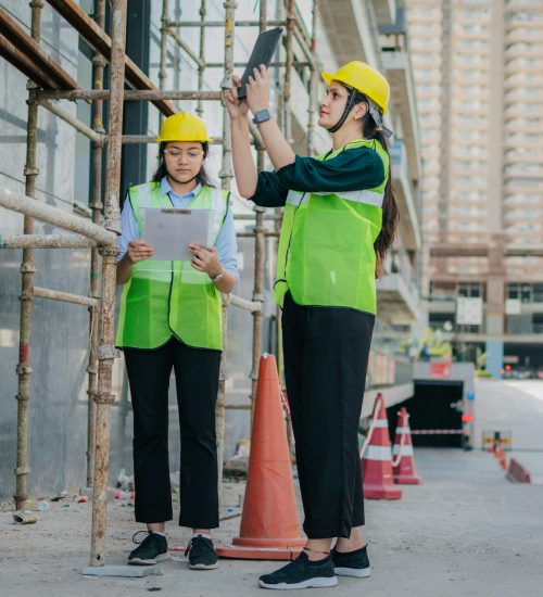 pramod-tiwari-8wNY8DOGy44-unsplash Female inspectors conducting site assessment and documenting property condition on a commercial construction site